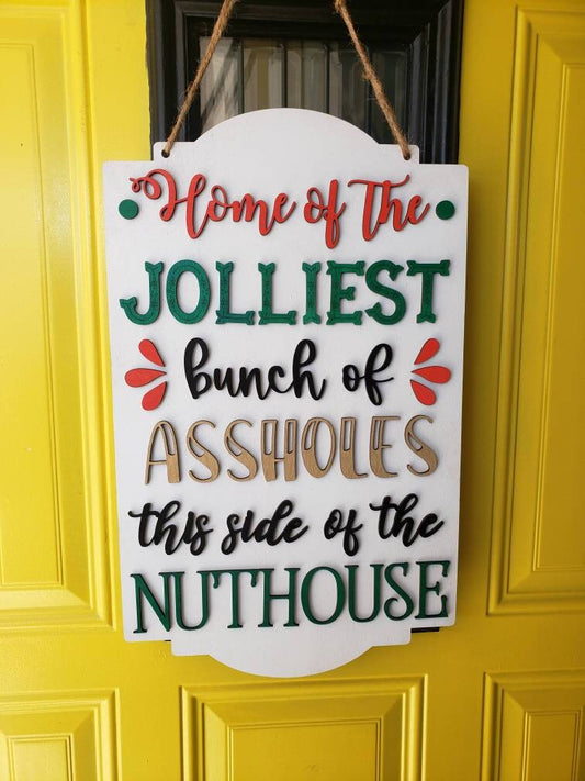 "Home of the Jolliest Bunch of Assholes" Sign